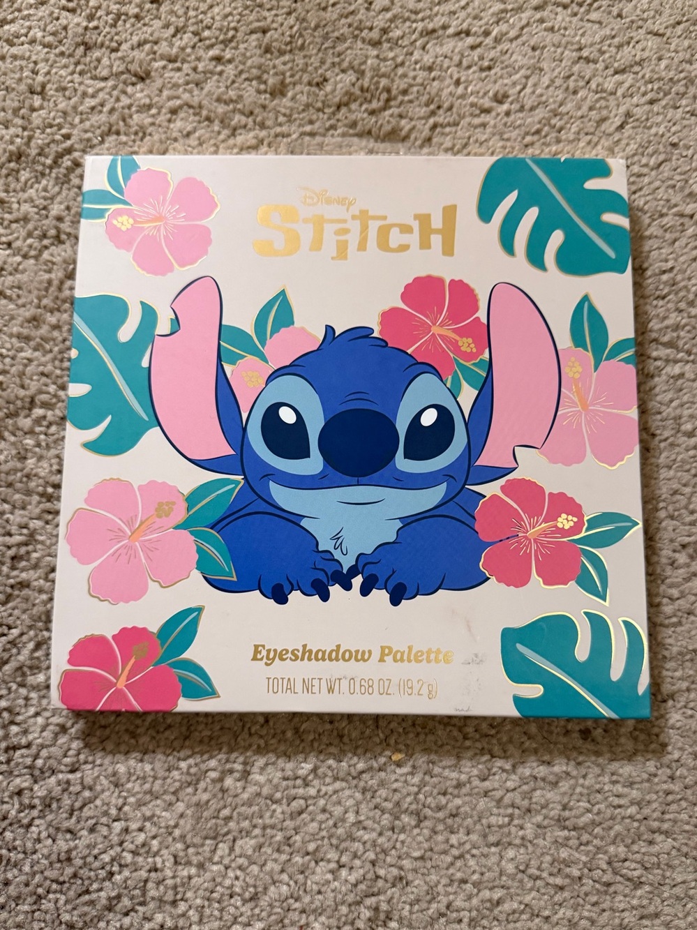 Disney Stitch-themed eyeshadow palette, featuring 16 tropical vibrant shades